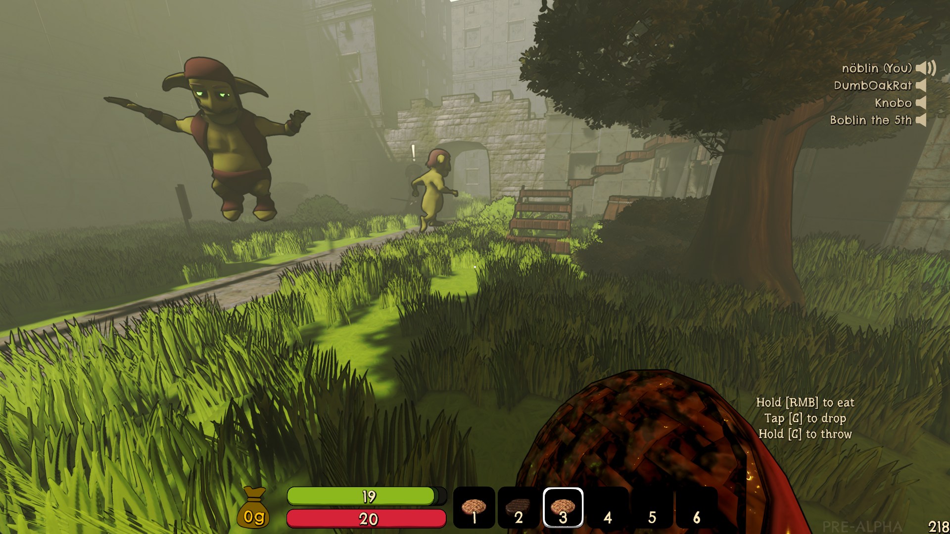Goblins frolicking in the grass of a castle courtyard